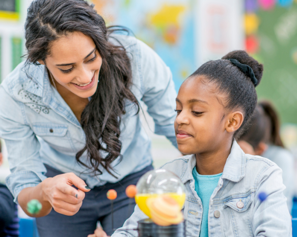 A Montessori guide interacts with a student. Montessorians know that observation is key. A tool called DERS can help.