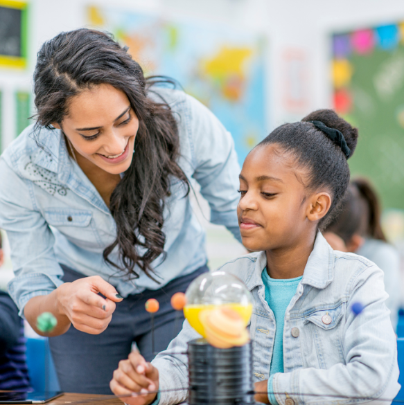 A Montessori guide interacts with a student. Montessorians know that observation is key. A tool called DERS can help.